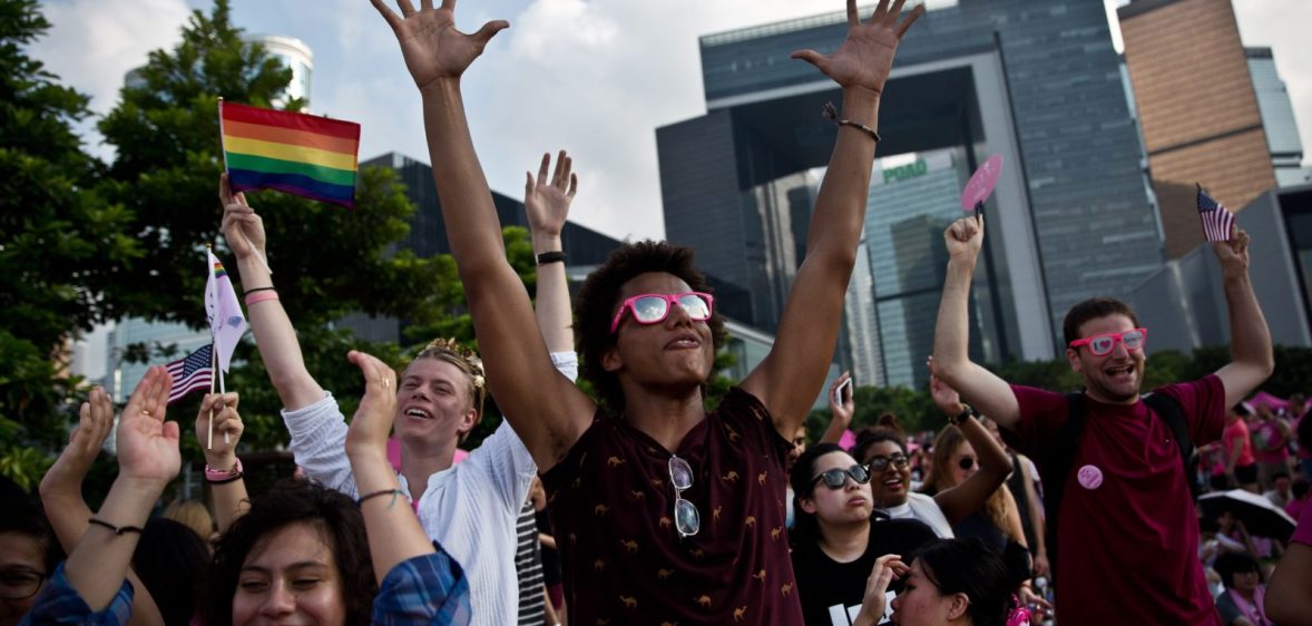 People dance as they attend a 'Pink Dot' event in Hong Kong on September 20, 2015. The LGBTI (lesbian, gay, bisexual, transgender/transsexual and intersex) event in its second year celebrated diversity under the theme "Love Is Love" and attracted some 15,000 visitors. AFP PHOTO / DALE DE LA REY (Photo credit should read DALE de la REY/AFP/Getty Images)