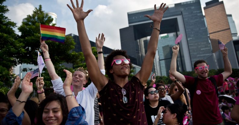People dance as they attend a 'Pink Dot' event in Hong Kong on September 20, 2015. The LGBTI (lesbian, gay, bisexual, transgender/transsexual and intersex) event in its second year celebrated diversity under the theme "Love Is Love" and attracted some 15,000 visitors. AFP PHOTO / DALE DE LA REY (Photo credit should read DALE de la REY/AFP/Getty Images)