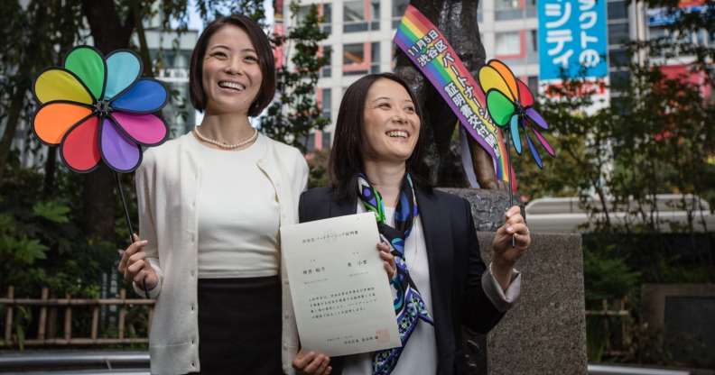 TOKYO, JAPAN - NOVEMBER 05: Japanese couple Koyuki Higashi (L) and Hiroko Masuhara (R) celebrate as hold up their same-sex marriage certificate in front of Shibuya's Hachiko statue on November 5, 2015 in Tokyo, Japan. Shibuya Ward in the Tokyo became the first local government in Japan to issue the official certificates recognizing same-sex partnerships. (Photo by Christopher Jue/Getty Images)
