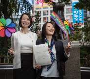 TOKYO, JAPAN - NOVEMBER 05: Japanese couple Koyuki Higashi (L) and Hiroko Masuhara (R) celebrate as hold up their same-sex marriage certificate in front of Shibuya's Hachiko statue on November 5, 2015 in Tokyo, Japan. Shibuya Ward in the Tokyo became the first local government in Japan to issue the official certificates recognizing same-sex partnerships. (Photo by Christopher Jue/Getty Images)