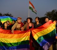 Activists are seen celebrating after India's Supreme Court agreed to lift a ban on same-sex relations.