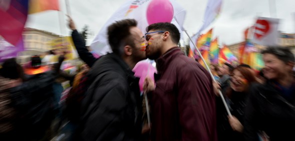 Supporters of LGBT associations kiss as they take part in a protest in central Rome on 5 March 2016.
