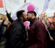 Supporters of LGBT associations kiss as they take part in a protest in central Rome on 5 March 2016.