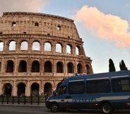 This photo taken on May 12, 2016 in Rome shows an Italian police van stationed outside of the Colosseum