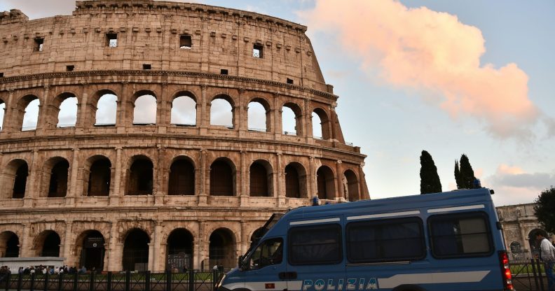 This photo taken on May 12, 2016 in Rome shows an Italian police van stationed outside of the Colosseum