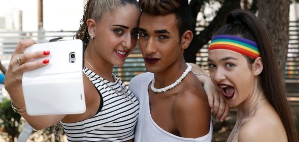 Participants use a phone to take a selfie at the opening event of the annual Gay Pride parade in the Israeli city of Tel Aviv, on June 3, 2016. A carefree and cosmopolitan crowd of tens of thousands of homosexuals, transsexuals and supporters took part it the Gay Pride in Tel Aviv, deemed one of the largest in the world where amid the crowd, tourists waved large flags of their country of origin to signify their presence in a city known as a rare oasis for LGBT (lesbian, gay, bi-sexual and transgender) in the Middle East. / AFP / JACK GUEZ (Photo credit should read JACK GUEZ/AFP/Getty Images)