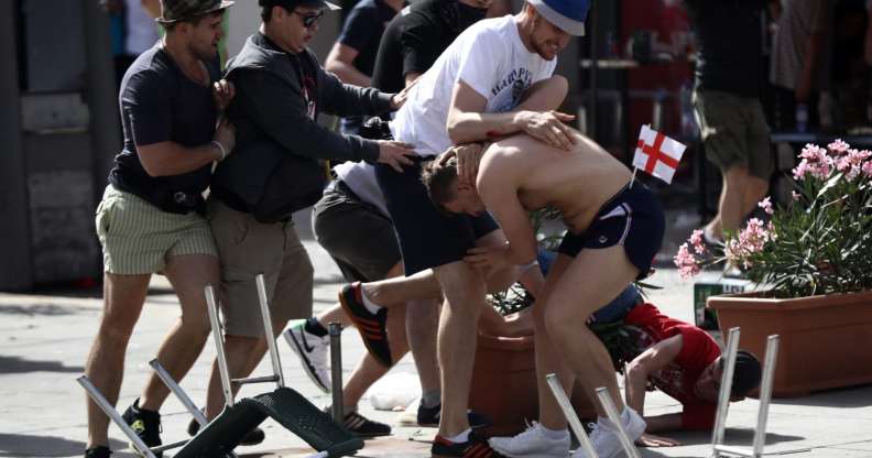 MARSEILLE, FRANCE - JUNE 11: England fans clash with Russian fans ahead of the game against Russia later today on June 11, 2016 in Marseille, France. Football fans from around Europe have descended on France for the UEFA Euro 2016 football tournament. (Photo by Carl Court/Getty Images)