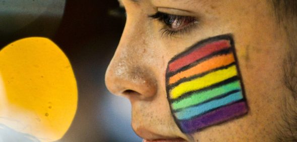 A Colombian LGBT community member takes part in a rally on June 15, 2016, in Cali, Colombia, in solidarity with the victims of the Orlando mass shooting. / AFP / LUIS ROBAYO (Photo credit should read LUIS ROBAYO/AFP/Getty Images)