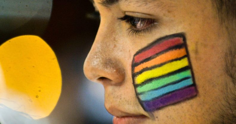 A Colombian LGBT community member takes part in a rally on June 15, 2016, in Cali, Colombia, in solidarity with the victims of the Orlando mass shooting. / AFP / LUIS ROBAYO (Photo credit should read LUIS ROBAYO/AFP/Getty Images)