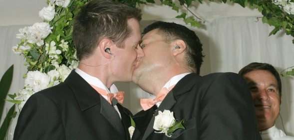 SYDNEY, NSW - NOVEMBER 25: Geoff Field (R) and Jason Kerr (L) kiss after marrying at Sydney's First Illegal Gay Wedding at Circular Quay November 25, 2005 in Sydney, Australia. (Photo by Stephane L'hostis/Getty Images)
