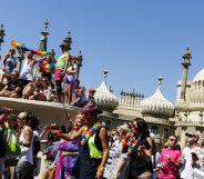 BRIGHTON, ENGLAND - AUGUST 06: People line the streets to watch the Brighton Pride Parade on August 6, 2016 in Brighton, England. (Photo by Tristan Fewings/Getty Images)