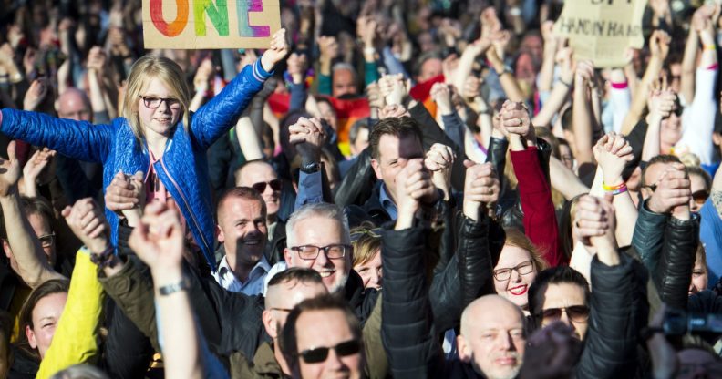People hold hands during the Hand in Hand for Diversity, a demonstration against anti-LGBT violence triggered after a gay couple was beaten up, on April 8, 2017 in Arnhem. / AFP PHOTO / ANP / Piroschka van de Wouw / Netherlands OUT (Photo credit should read PIROSCHKA VAN DE WOUW/AFP/Getty Images)