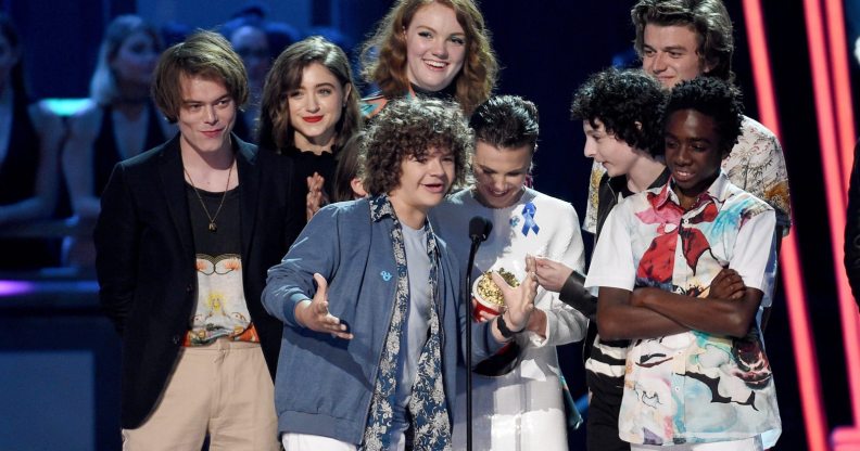 LOS ANGELES, CA - MAY 07: (L-R) Actors Gaten Matarazzo, Charlie Heaton, Noah Schnapp, Natalia Dyer, Shannon Purser, Millie Bobby Brown, Finn Wolfhard, Joe Keery, and Caleb McLaughlin accept the award for Show of the Year onstage during the 2017 MTV Movie And TV Awards at The Shrine Auditorium on May 7, 2017 in Los Angeles, California. (Photo by Kevork Djansezian/Getty Images)