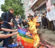 Far-right activists burn the LGBT flag during the official opening of Kyiv Pride 2017