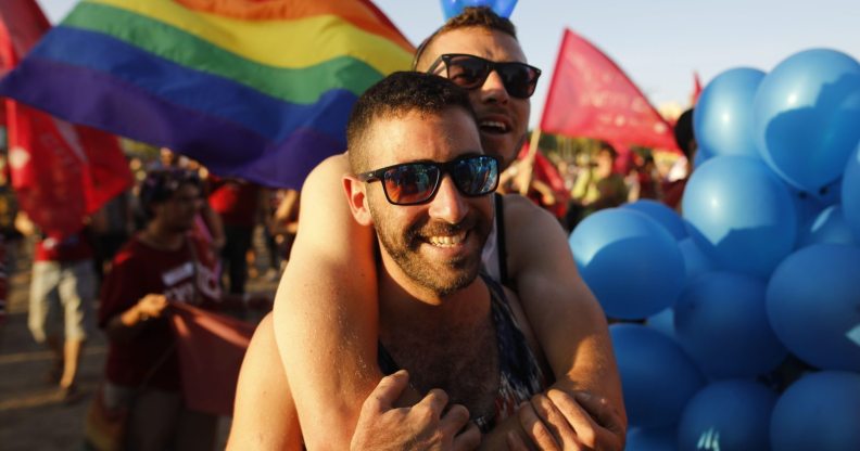 Israelis take part in the first annual Gay Pride parade in the southern Israeli city of Beersheba, on June 22, 2017. Hundreds of Israelis march in Beershebas first gay pride after the head of the southern police district approved plans for the event. / AFP PHOTO / MENAHEM KAHANA (Photo credit should read MENAHEM KAHANA/AFP/Getty Images)