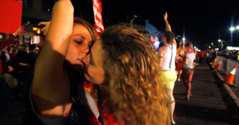 SYDNEY, AUSTRALIA - MARCH 01: Two woman kiss during the Sydney Gay & Lesbian Mardi Gras Parade on Oxford Street on March 1, 2008 in Sydney, Australia. This year marks the 30th Anniversary of the Sydney Gay & Lesbian Mardi Gras festival which originally began as a protest march but is now a celebration of the pride and diversity within the community. (Photo by Sergio Dionisio/Getty Images)