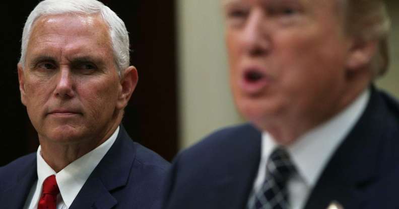 WASHINGTON, DC - JULY 18: U.S. Vice President Mike Pence listens as President Donald Trump speaks to members of the media during a lunch with armed service members at the Roosevelt Room of the White House July 18, 2017 in Washington, DC. President Trump took questions from the press and discussed the status of the healthcare legislation. (Photo by Alex Wong/Getty Images)