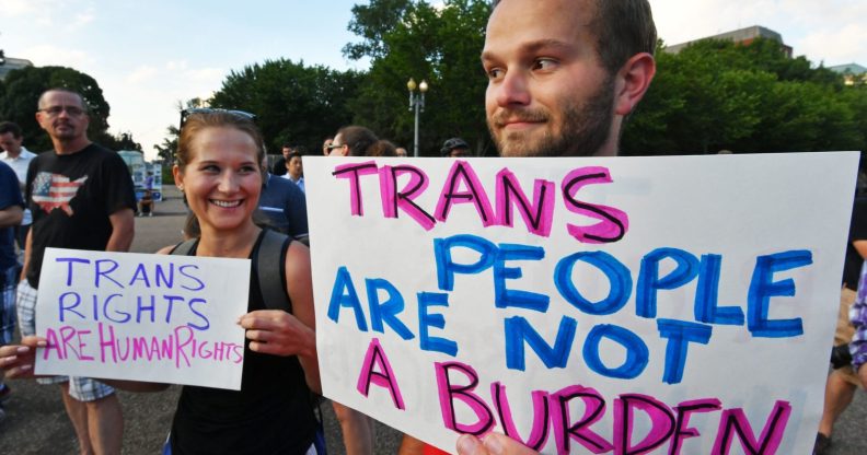 Protesters gather in front of the White House on July 26, 2017, in Washington, DC. Trump announced on July 26 that transgender people may not serve "in any capacity" in the US military, citing the "tremendous medical costs and disruption" their presence would cause. / AFP PHOTO / PAUL J. RICHARDS (Photo credit should read PAUL J. RICHARDS/AFP/Getty Images)