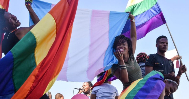 Dozens of people cheer and dance as they take part in the Namibian Lesbians, Gay, Bisexual and Transexual (LGBT) community pride Parade in the streets of the Namibian Capitol on July 29, 2017 in Windhoek. Even though there have been marches and protests against discrimination against the LGBT community in the past years, this is the first time that the community held such a parade along the capital's main street, Independence Avenue, to celebrate their identity and rights. / AFP PHOTO / Hildegard Titus (Photo credit should read HILDEGARD TITUS/AFP/Getty Images)