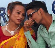 Nepali transgender woman Monika Shahi Nath (L) talks with her husband Ramesh Nath (R) during a press conference to announce the registration of their marriage, in Kathmandu on August 5, 2017. A Nepali transgender woman and a man registered their marriage, a first in the country, the couple said on August 5, despite an absence of laws legalising same-sex or transgender unions. Monika Shahi Nath, 40, who legally identifies as a third gender, married Ramesh Nath Yogi, 22, in May and was able to register it in their home district Dadeldhura in western Nepal last month. / AFP PHOTO / PRAKASH MATHEMA (Photo credit should read PRAKASH MATHEMA/AFP/Getty Images)