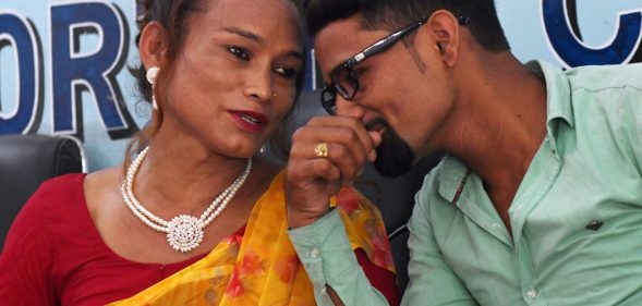 Nepali transgender woman Monika Shahi Nath (L) talks with her husband Ramesh Nath (R) during a press conference to announce the registration of their marriage, in Kathmandu on August 5, 2017. A Nepali transgender woman and a man registered their marriage, a first in the country, the couple said on August 5, despite an absence of laws legalising same-sex or transgender unions. Monika Shahi Nath, 40, who legally identifies as a third gender, married Ramesh Nath Yogi, 22, in May and was able to register it in their home district Dadeldhura in western Nepal last month. / AFP PHOTO / PRAKASH MATHEMA (Photo credit should read PRAKASH MATHEMA/AFP/Getty Images)