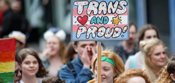 GLASGOW, SCOTLAND - AUGUST 19: A participant holds a sign saying "Trans and Proud" during the Glasgow Pride march on August 19, 2017 in Glasgow, Scotland. The largest festival of LGBTI celebration in Scotland has been held every year in Glasgow since 1996. (Photo by Robert Perry/Getty Images)