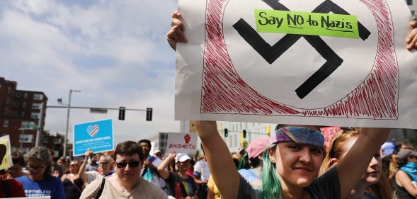 BOSTON, MA - AUGUST 19: Thousands of protesters march in Boston against a planned 'Free Speech Rally' just one week after the violent 'Unite the Right' rally in Virginia left one woman dead and dozens more injured on August 19, 2017 in Boston, United States. Although the rally organizers stress that they are not associated with any alt-right or white supremacist groups, the city of Boston and Police Commissioner William Evans are preparing for possible confrontations at the afternoon rally. (Photo by Spencer Platt/Getty Images)