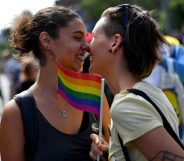 TOPSHOT - Two women react during the Gay Pride parade on September 17, 2017 in Belgrade. Serbia's lesbian prime minister on September 17 joined hundreds of activists with rainbow flags for Belgrade's annual gay pride march, an event held under heavy security in the conservative country. Belgrade's first Pride march, in 2001, ended with police firing in the air to disperse anti-gay nationalists and skinheads who stoned and beat participants. / AFP PHOTO / ANDREJ ISAKOVIC (Photo credit should read ANDREJ ISAKOVIC/AFP/Getty Images)