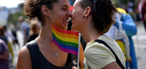 TOPSHOT - Two women react during the Gay Pride parade on September 17, 2017 in Belgrade. Serbia's lesbian prime minister on September 17 joined hundreds of activists with rainbow flags for Belgrade's annual gay pride march, an event held under heavy security in the conservative country. Belgrade's first Pride march, in 2001, ended with police firing in the air to disperse anti-gay nationalists and skinheads who stoned and beat participants. / AFP PHOTO / ANDREJ ISAKOVIC (Photo credit should read ANDREJ ISAKOVIC/AFP/Getty Images)
