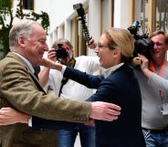 Alexander Gauland (L) and Alice Weidel, both top candidates of Germany's nationalist Alternative for Germany (AfD) party, hug prior to a press conference in Berlin on September 25, 2017, one day after general elections. The election spelt a breakthrough for the anti-Islam Alternative for Germany (AfD), which with 12.6 percent became the third strongest party and vowed to "go after" chancellor Angela Merkel over her migrant and refugee policy. / AFP PHOTO / Tobias SCHWARZ (Photo credit should read TOBIAS SCHWARZ/AFP/Getty Images)