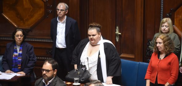 Uruguayan senator Michelle Suarez (C) arrives at the senate for her swear in ceremony in Montevideo, on October 10, 2017. Michelle Suarez is the first transgender lawmaker to have a seat in the Uruguayan parliament. / AFP PHOTO / MIGUEL ROJO (Photo credit should read MIGUEL ROJO/AFP/Getty Images)