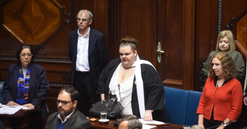 Uruguayan senator Michelle Suarez (C) arrives at the senate for her swear in ceremony in Montevideo, on October 10, 2017. Michelle Suarez is the first transgender lawmaker to have a seat in the Uruguayan parliament. / AFP PHOTO / MIGUEL ROJO (Photo credit should read MIGUEL ROJO/AFP/Getty Images)