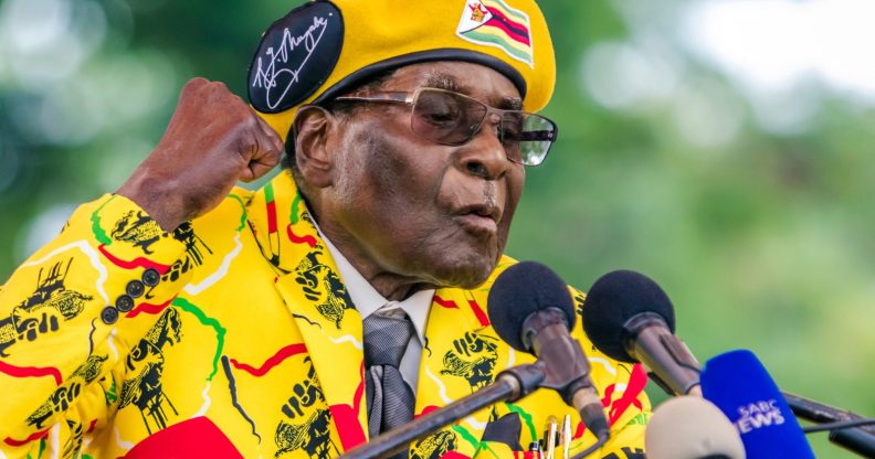 Zimbabwe's President Robert Mugabe addresses party members and supporters gathered at his party headquarters to show support to Grace Mugabe becoming the party's next Vice President after the dismissal of Emerson Mnangagwa November 8 2017. Zimbabwe's sacked vice president, Emmerson Mnangagwa, said on November 8, 2017, he had fled the country, as he issued a direct challenge to long-ruling President Robert Mugabe and his wife Grace. / AFP PHOTO / Jekesai NJIKIZANA (Photo credit should read JEKESAI NJIKIZANA/AFP/Getty Images)