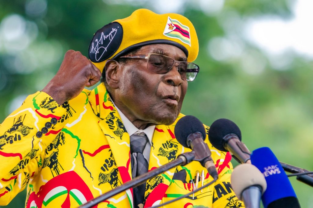 Zimbabwe's President Robert Mugabe addresses party members and supporters gathered at his party headquarters to show support to Grace Mugabe becoming the party's next Vice President after the dismissal of Emerson Mnangagwa November 8 2017. Zimbabwe's sacked vice president, Emmerson Mnangagwa, said on November 8, 2017, he had fled the country, as he issued a direct challenge to long-ruling President Robert Mugabe and his wife Grace. / AFP PHOTO / Jekesai NJIKIZANA (Photo credit should read JEKESAI NJIKIZANA/AFP/Getty Images)