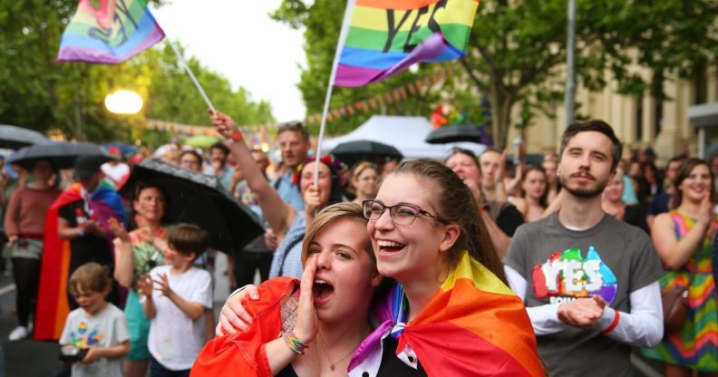 MELBOURNE, AUSTRALIA - NOVEMBER 15: Supporters of the 'Yes' vote for marriage equality celebrate at Melbourne's Result Street Party on November 15, 2017 in Melbourne, Australia. Australians have voted for marriage laws to be changed to allow same-sex marriage, with the Yes vote claiming 61.6% to to 38.4% for No vote. Despite the Yes victory, the outcome of Australian Marriage Law Postal Survey is not binding, and the process to change current laws will move to the Australian Parliament in Canberra. (Photo by Scott Barbour/Getty Images)