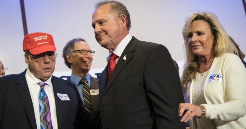 BIRMINGHAM, AL - NOVEMBER 16: Republican candidate for U.S. Senate Judge Roy Moore and his wife Kayla Moore exit a news conference with supporters and faith leaders, November 16, 2017 in Birmingham, Alabama. Moore refused to answer questions regarding sexual harassment allegations and pursuing relationships with underage women. (Drew Angerer/Getty Images)