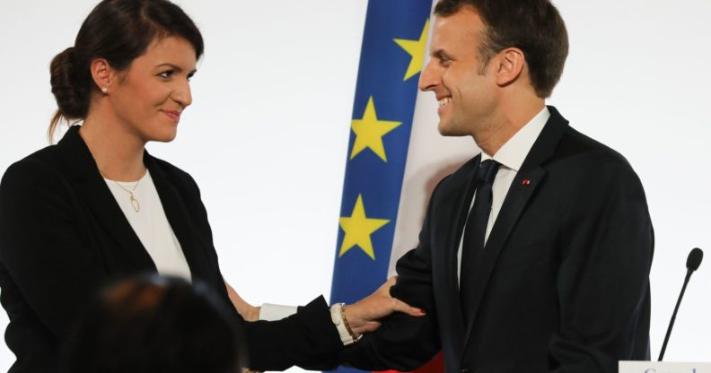 French President Emmanuel Macron (R) smiles to French Junior Minister for Gender Equality Marlene Schiappa after he delivered a speech during the International Day for the Elimination of Violence Against Women, on November 25, 2017 at the Elysee Palace in Paris. / AFP PHOTO / POOL / LUDOVIC MARIN (Photo credit should read LUDOVIC MARIN/AFP/Getty Images)