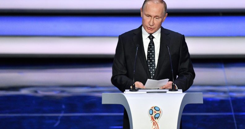 Russian President Vladimir Putin speaks prior to the start of the Final Draw for the 2018 FIFA World Cup football tournament (MLADEN ANTONOV/AFP/Getty Images)