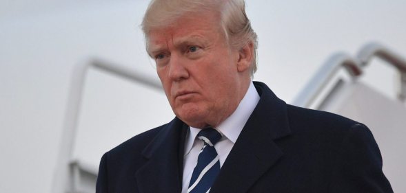 US President Donald Trump steps off Air Force One upon arrival at Andrews Air Force Base in Maryland on December 2, 2017. Trump is returning to Washington, DC after attending fundraisers in New York, New York. / AFP PHOTO / MANDEL NGAN (Photo credit should read MANDEL NGAN/AFP/Getty Images)