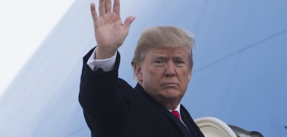 US President Donald Trump waves from Air Force One prior to departure from Andrews Air Force Base in Maryland, December 4, 2017, as Trump travels to Salt Lake City, Utah. / AFP PHOTO / SAUL LOEB (Photo credit should read SAUL LOEB/AFP/Getty Images)