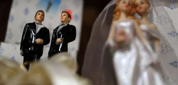 Wedding cake figures of a gay and lesbian married couples