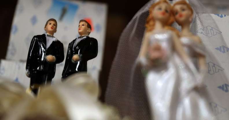 Wedding cake figures of a gay and lesbian married couples