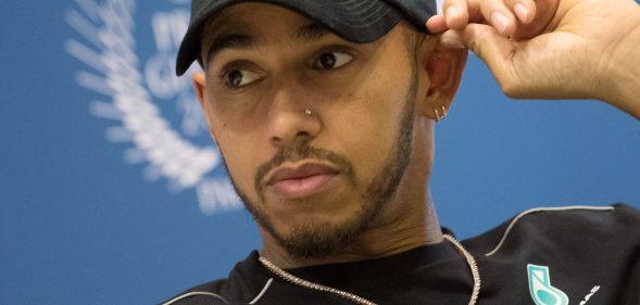 World's Formula One British driver Lewis Hamilton attends a press conference of the FIA (International Automobile Federation) on December 8, 2017 in Paris. / AFP PHOTO / CHRISTOPHE SIMON (Photo credit should read CHRISTOPHE SIMON/AFP/Getty Images)