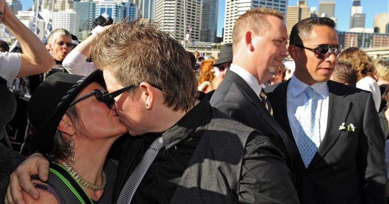 Lesbian and gay couples embrace outside the ruling Labor Party's conference during a mass 'illegal wedding' in Sydney on August 1, 2009. The national Labor conference voted to develop a system for the registration and recognition of same-sex relationships, after gay rights advocates failed to gather enough numbers for a resolution to legalise gay marriage. Australian Prime Minister Kevin Rudd won the 2007 election on a platform that supported the former conservative government's legal definition of marriage as a union between a man and a woman. AFP PHOTO/Torsten BLACKWOOD (Photo credit should read TORSTEN BLACKWOOD/AFP/Getty Images)