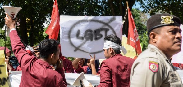 A group of Muslim protesters march with banners against the lesbian, gay, bisexual and transgender (LGBT) community in Banda Aceh on Decmber 27, 2017