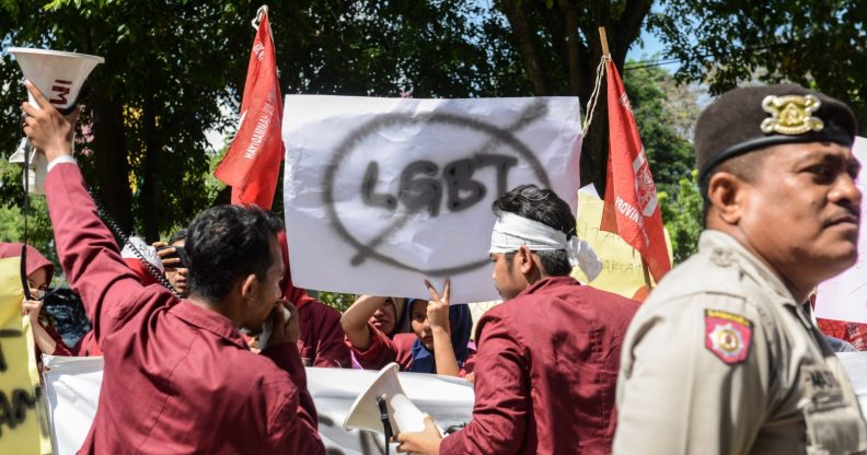 A group of Muslim protesters march with banners against the lesbian, gay, bisexual and transgender (LGBT) community in Banda Aceh on Decmber 27, 2017