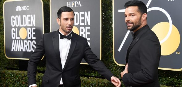 Ricky Martin (R) and Jwan Yosef attend The 75th Annual Golden Globe Awards (Photo by Frazer Harrison/Getty Images)