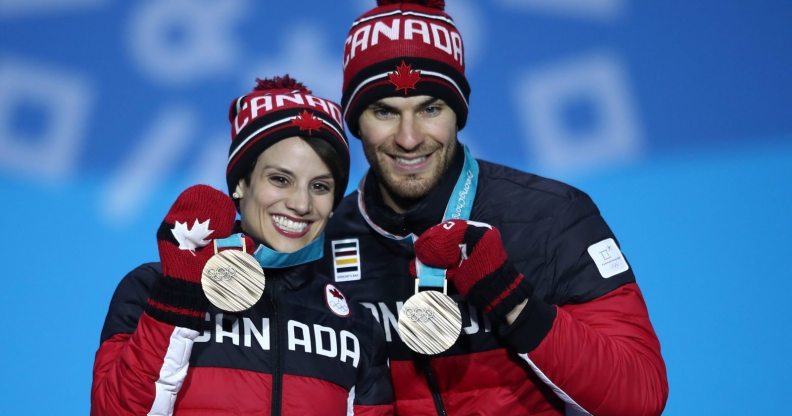 PYEONGCHANG-GUN, SOUTH KOREA - FEBRUARY 15: Bronze medalists Meagan Duhamel and Eric Radford of Canada celebrate during the medal ceremony for the Pair Skating Free Skating on day six of the PyeongChang 2018 Winter Olympic Games at Medal Plaza on February 15, 2018 in Pyeongchang-gun, South Korea. (Photo by Clive Mason/Getty Images)