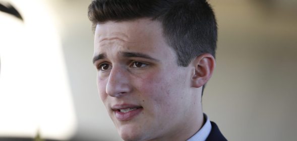Marjory Stoneman Douglas High School student Cameron Kasky speaks with the media in Parkland, Florida on February 16, 2018, two days after former student Nikolas Cruz opened fire at the school leaving 17 people dead and 15 injured. Stoneman Douglas students have taken to social media to blast defenders of the nation's loose gun laws. In an eloquent essay published online, 17-year-old Cameron Kasky blasted both Republican and Democratic politicians for not doing anything. "We can't ignore the issues of gun control that this tragedy raises," he wrote. "And so, I'm asking -- no, demanding -- we take action now. Why? Because at the end of the day, the students at my school felt one shared experience -- our politicians abandoned us by failing to keep guns out of schools." / AFP PHOTO / RHONA WISE (Photo credit should read RHONA WISE/AFP/Getty Images)