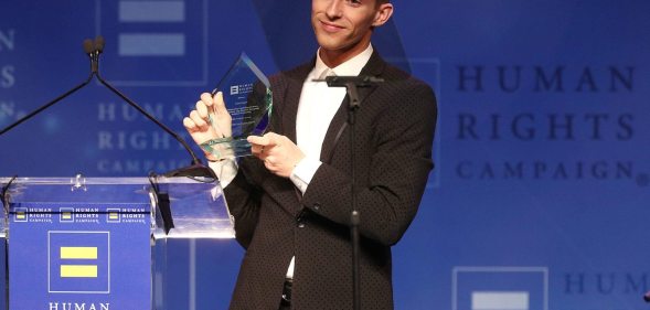 LOS ANGELES, CA - MARCH 10: Adam Rippon celebrates as he is honored with the Visibilty Award during the Human Rights Campaign 2018 Los Angeles Dinner at JW Marriott Los Angeles at L.A. LIVE on March 10, 2018 in Los Angeles, California. (Photo by Frederick M. Brown/Getty Images)